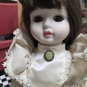 Porcelain Doll with Cream Dress